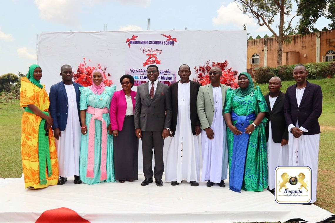 Hon. Choltilda Nakate and the Katikkiro with the school board Hon. Choltilda Nakate and the Katikkiro with the school board